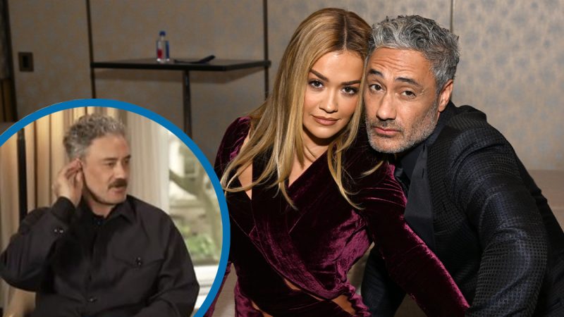 Taika Waititi rips his earpiece out mid-interview to dodge Rita Ora wedding question