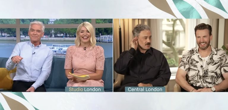 Taika Waititi rips his earpiece out mid-interview to dodge Rita Ora wedding question