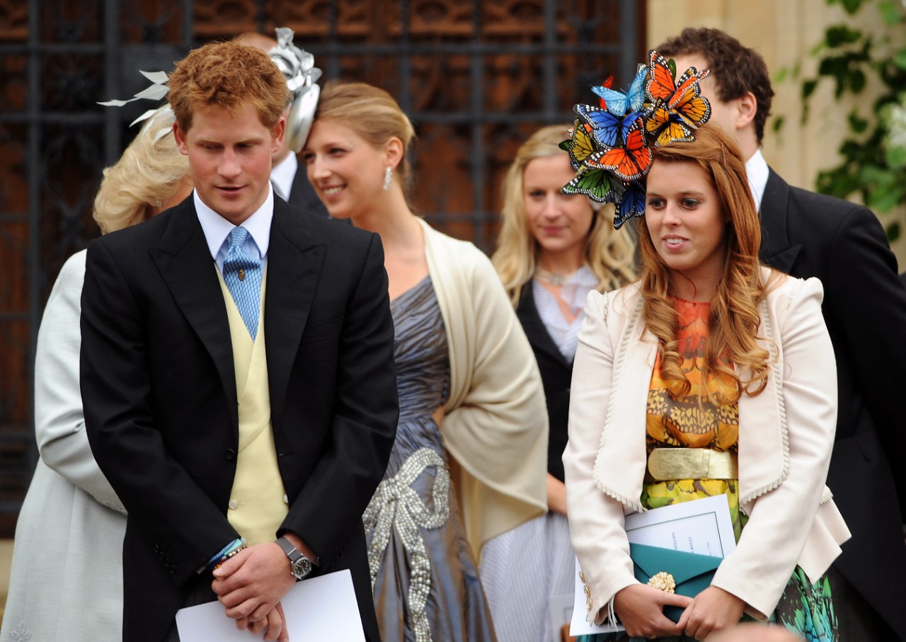 WINDSOR, ENGLAND - MAY 17: (NO PUBLICATION IN UK MEDIA FOR 28 DAYS) Prince Harry stands with cousin Princess Beatrice at the wedding of Peter Phillips to Autumn Kelly, at St George's Chapel in Windsor Castle on May 17, 2008 in Windsor, England. (Photo by POOL/Tim Graham Picture Library/Getty Images)