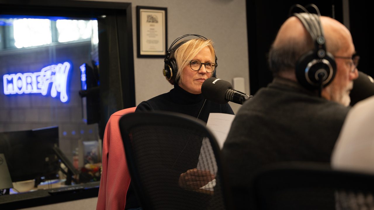 Former More FM newsreader Hilary Barry behind the station microphone (Photo: More FM/Tan Huynh)