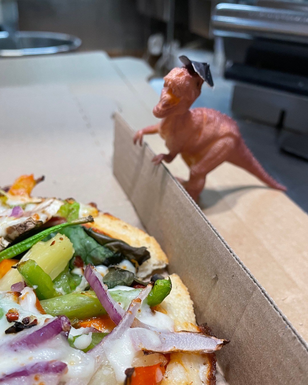 Domino's NZ hires Bitey the T-Rex after family leaves him behind - and he's gone viral
